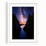 Framed landscape artwork depicting dramatic cliffs against a serene sky, featuring a white mat and sleek black frame, perfect for modern home decor.