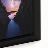 Close-up of a framed canvas depicting dramatic cliffs and lush landscapes, showcasing vibrant greens and earthy tones, perfect for home decor.