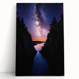 Stretched canvas artwork depicting a serene landscape with dramatic cliffs and lush greenery, perfect for adding a natural touch to home decor.