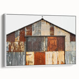 Barn-style canvas artwork framed in white, showcasing a landscape design with vibrant colors and intricate details, ideal for modern home decor.