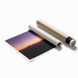 Desert landscape rolled print featuring vibrant hues of orange and yellow, showcasing a serene sunset over sand dunes, packaged securely in a protective tube. Ideal for home decor enthusiasts seeking nature-inspired art.