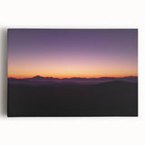 Desert landscape stretched canvas art showcasing vibrant hues of orange and blue, capturing a serene sunset over dunes, perfect for home decor.