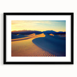 Black-framed landscape art print showcasing vibrant dunes against a clear blue sky, elegantly matted for a polished appearance, ideal for modern decor.