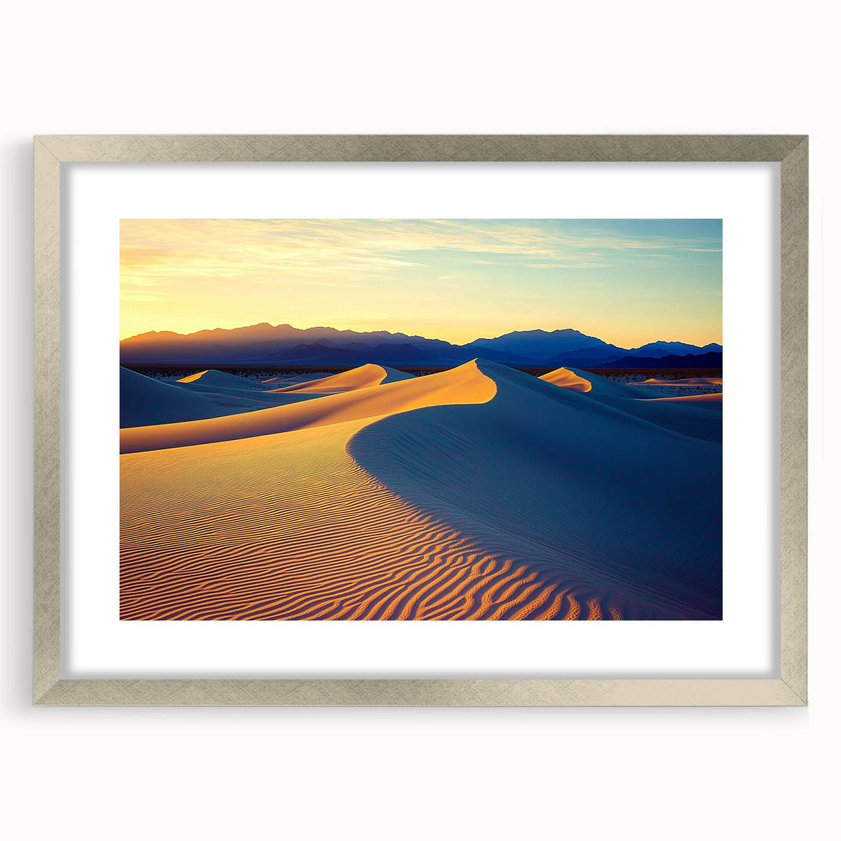 Framed landscape artwork depicting serene sand dunes in soft beige and gold tones, elegantly matted with a silver frame, ideal for modern home decor.