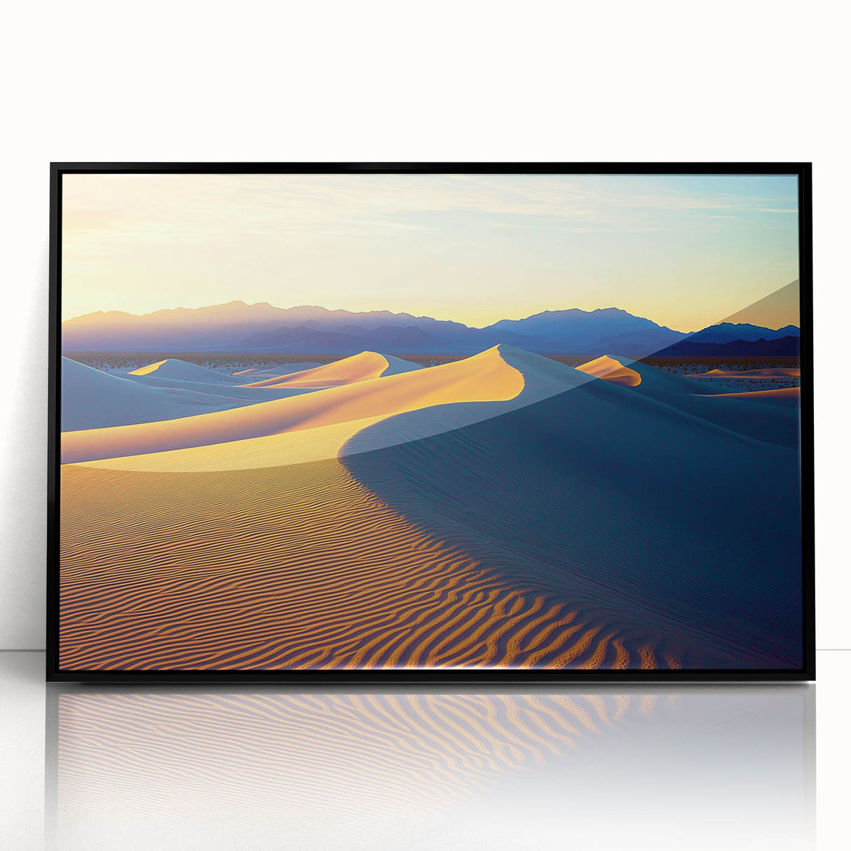 Framed acrylic artwork showcasing a stunning desert dune landscape with rich golden hues and dramatic shadows, set in a sleek black frame for modern decor.