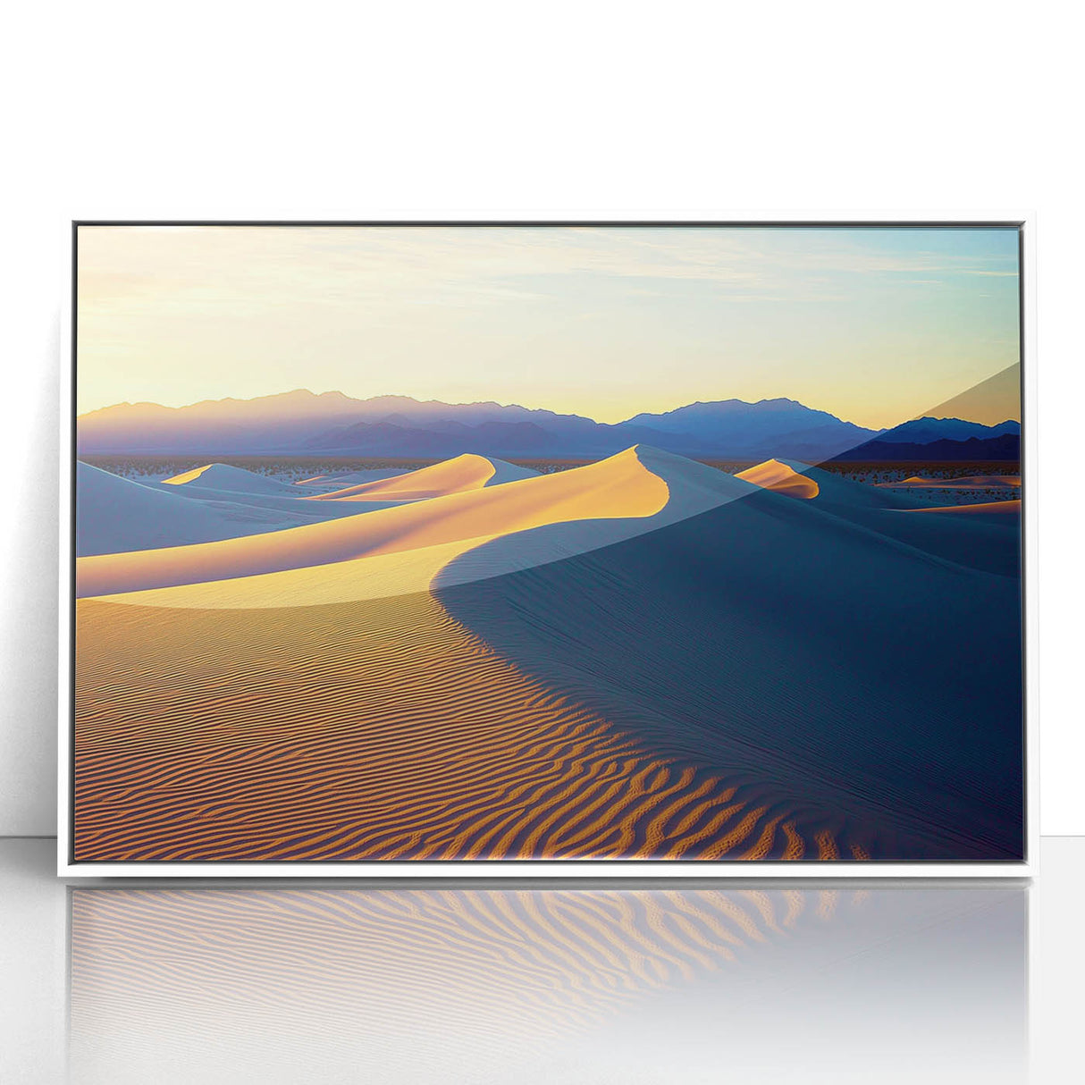 Framed acrylic artwork showcasing a serene landscape of golden sand dunes under a bright blue sky, elegantly displayed in a sleek white frame, perfect for modern decor.