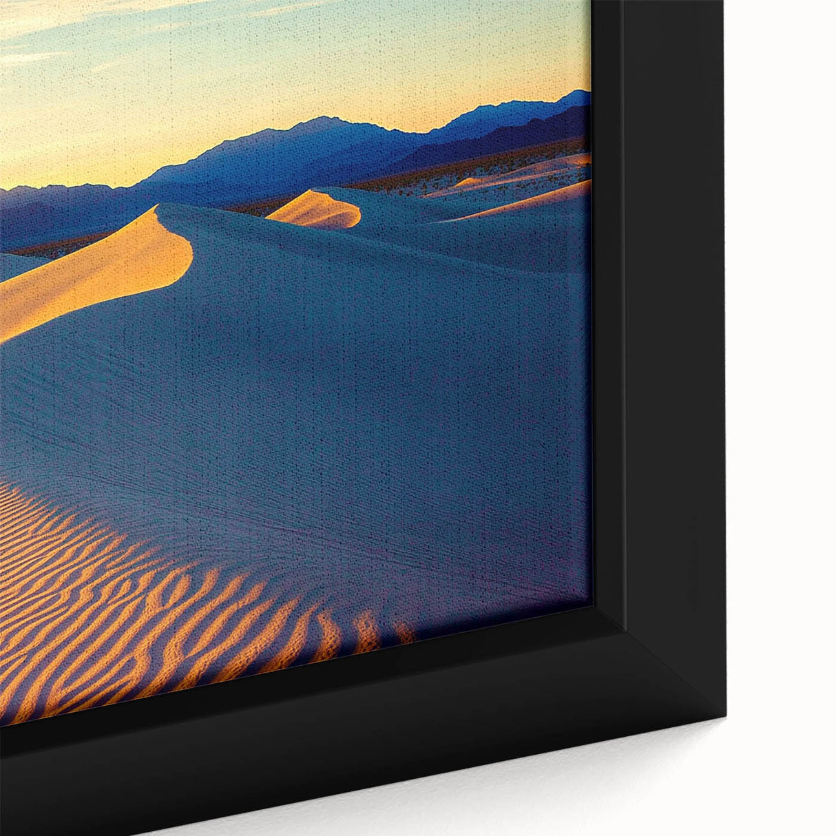 Close-up of a framed canvas depicting a serene desert landscape with golden dunes and soft shadows, showcasing warm tones and intricate textures, perfect for home decor.