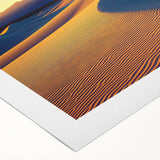 Rolled canvas depicting a serene landscape of golden sand dunes under a clear blue sky, showcasing intricate textures, perfect for home decor or art enthusiasts.