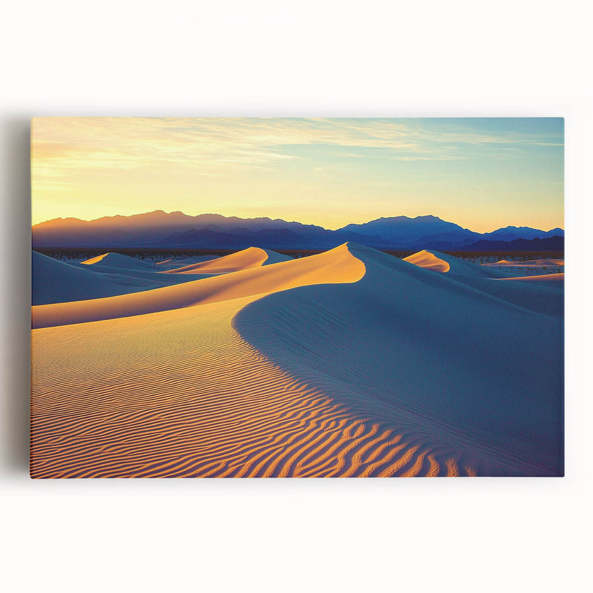 Stretched canvas artwork showcasing a serene landscape of rolling sand dunes at sunset, featuring warm hues of orange and gold, perfect for enhancing home decor.