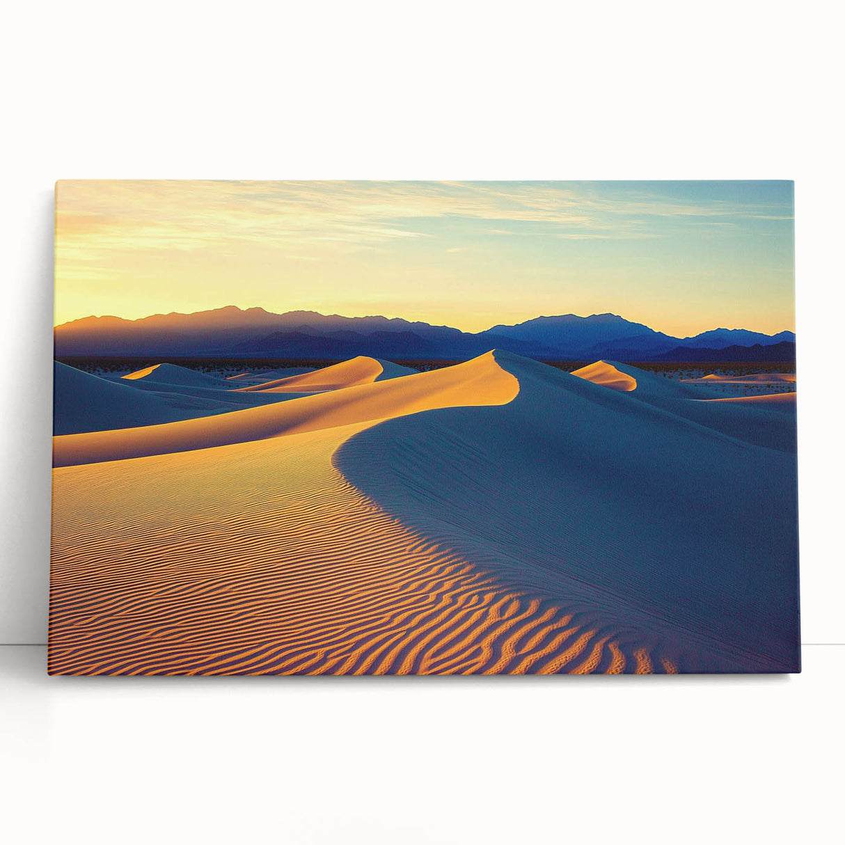 Stretched canvas artwork depicting serene desert dunes at sunset, showcasing warm golden and soft orange hues, perfect for modern home decor.