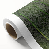 Art deco poster of close-up leaves in green tones on rolled canvas, ideal for nursery wall art.