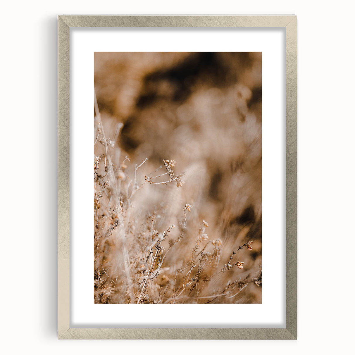Textured abstract art print in autumn hues on a silver-framed canvas, ideal for bedroom wall decor.
