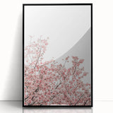 Large abstract wall art depicting spring colors on black framed acrylic, ideal for modern living room decor.