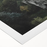 Rolled canvas artwork showcasing a vibrant landscape with a majestic castle set against a dramatic sky, packaged securely in a cardboard tube for safe delivery.