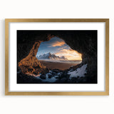 Elegant gold-framed landscape print featuring a serene cave scene, ideal for home decor. The artwork is presented with a white mat, enhancing its visual appeal.