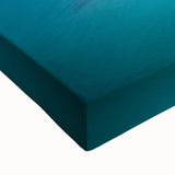 Close-up of a vibrant stretched canvas featuring a dramatic cliffside landscape with rich colors and intricate details, perfect for enhancing home decor.