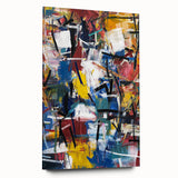 Abstract acrylic splatter artwork displayed on a clear glass panel, showcasing vibrant colors and dynamic patterns, emphasizing modern home decor aesthetics.