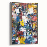 Framed canvas artwork showcasing abstract splatter designs in vibrant colors with a sleek silver frame, ideal for modern home decor accents.