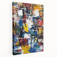 Abstract splatter art on stretched canvas showcasing vibrant colors like blue, yellow, and red, perfect for modern home decor or artistic spaces.