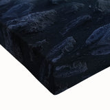 Close-up of a vibrant stretched canvas artwork depicting a serene landscape bridge surrounded by lush greenery, emphasizing intricate details and textures.