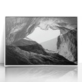 Framed acrylic art piece showcasing a stunning landscape of canyons with vibrant earth tones and intricate details, set against a sleek white frame, ideal for modern home decor.