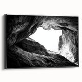 Framed canvas artwork depicting a stunning landscape of canyons in warm earth tones, set against a sleek black frame, perfect for modern home decor.