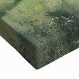 Close-up of a stretched canvas print showcasing a vibrant countryside landscape, featuring lush green fields, a blue sky, and soft clouds, perfect for home decor.