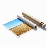 Rolling countryside landscape print showcasing vibrant green fields and a serene blue sky, elegantly packaged in a protective cardboard tube for safe delivery.