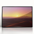 Framed acrylic artwork depicting a vibrant desert landscape with warm tones of orange and yellow, set in a sleek black frame, ideal for modern decor.