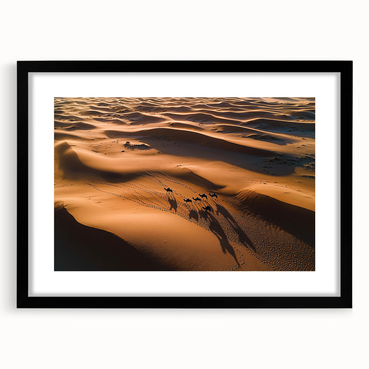 Black-framed artwork showcasing a serene landscape of golden dunes under a bright blue sky, elegantly matted for a polished presentation, perfect for home decor.