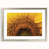 Textured art print of abstract florals in muted earth tones, framed in silver, ideal for bedroom wall decor.