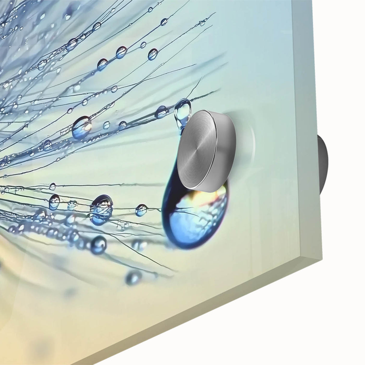 Close-up of water droplets on acrylic glass, featuring a large abstract design in muted blue and green.