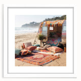Abstract art print featuring a colorful caravan design on a white framed mat, ideal for dining room decor.