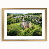 Elegant gold-framed landscape artwork depicting a majestic castle surrounded by serene nature. The image features intricate details and vibrant colors, ideal for home decor.