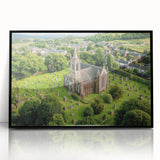 Framed acrylic artwork depicting a scenic landscape with a majestic castle set against a vibrant sunset, featuring a sleek black frame that enhances its elegance.