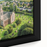 Close-up of a framed canvas artwork depicting a picturesque landscape with a majestic castle, showcasing vibrant colors and intricate details that enhance interior decor.