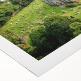 Rolled canvas showcasing a picturesque landscape with a majestic castle, featuring vibrant colors and intricate details, ideal for home decor enthusiasts.