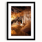 Black framed landscape artwork featuring a cave scene, elegantly matted for added depth. Ideal for home decor, this piece enhances any interior aesthetic.