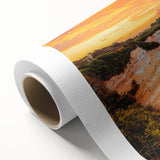 Vibrant rolled canvas depicting a stunning landscape with dramatic cliffs and a serene ocean view, ideal for home decor or art enthusiasts, securely packaged for delivery.