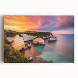 Stretched canvas artwork depicting a breathtaking landscape of cliffs against a vibrant sunset, showcasing rich colors and intricate details, perfect for home decor.