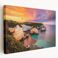 Stretched canvas artwork depicting dramatic cliffs against a vibrant sunset, showcasing rich color gradients and intricate details, perfect for home decor.