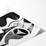 Abstract geometric rolled print showcasing vibrant colors and intricate patterns, elegantly packaged in a protective cardboard tube for easy display and transport.