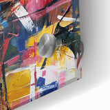 Colorful abstract acrylic splatter artwork on glass, showcasing vibrant blue, yellow, and red hues. Ideal for modern decor or art lovers seeking unique wall pieces.