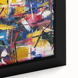 Abstract close-up of a framed canvas featuring colorful splatters in shades of blue, yellow, and red, perfect for adding a modern artistic touch to any space. Ideal for contemporary decor enthusiasts.