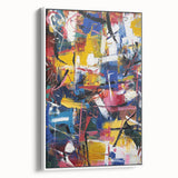 Framed abstract splatter art canvas in white, showcasing vibrant color contrasts and dynamic patterns, ideal for modern home decor or office aesthetics.