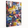 Abstract splatter art canvas with vibrant blue, yellow, and red colors, showcasing a dynamic design; perfect for modern home decor and artistic expression.