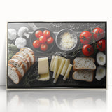 Mid-century modernist art depicting various food dishes in muted colors on a silver-framed acrylic print.