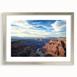 Landscape artwork of a canyon scene framed in a sleek silver mat, showcasing earthy tones and intricate details, perfect for home decor and art enthusiasts.