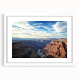 Framed landscape artwork showcasing vibrant canyons in rich earth tones, featuring a sleek white mat and a modern frame, perfect for home decor enhancement.
