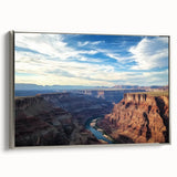 Framed canvas artwork depicting a stunning landscape of canyons, featuring rich earthy tones and intricate details, showcased from a silver side view, perfect for home decor.